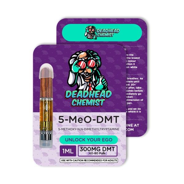 Close-up of a DMT cart showing golden liquid inside a transparent glass chamber with a mouthpiece on top, used for inhalation.